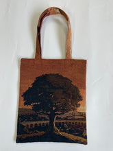 Load image into Gallery viewer, Reverse side of Avatar tapestry tote bag with sunset tree design

