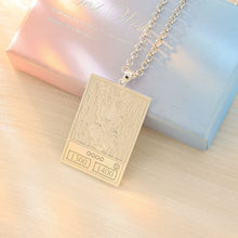 Load image into Gallery viewer, Silver Harpie Lady pendant close-up beside presentation box
